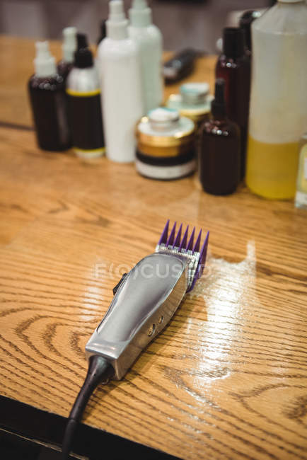 Electric trimmer on dressing table in barber shop — Stock Photo