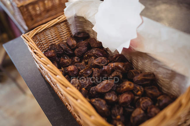 Close-up of dried dates in basket on counter in shop — Stock Photo