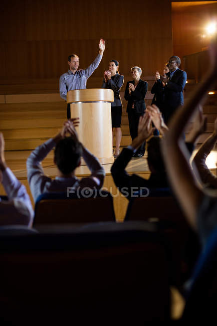 Audience applauding speaker after conference presentation at conference center — Stock Photo