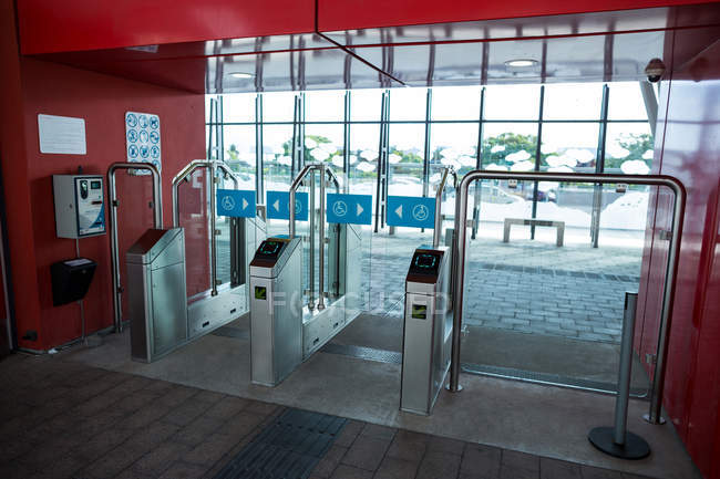Security gates with metal detectors and scanners at entrance of airport — Stock Photo