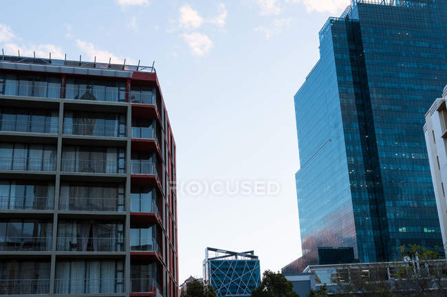 Modern office buildings in city in twilight — Stock Photo