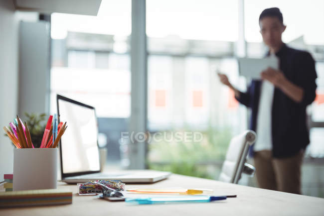 Office accessories with laptop on table in office — Stock Photo