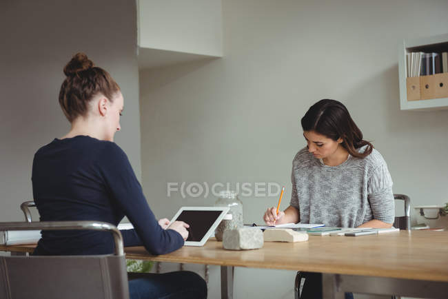 Business executives working together in office — Stock Photo