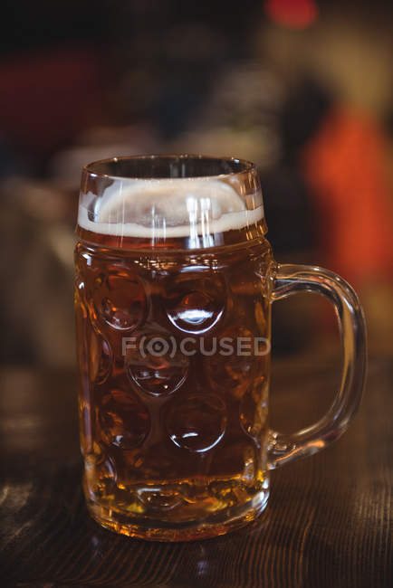 Close-up of glass of beer in bar — Stock Photo