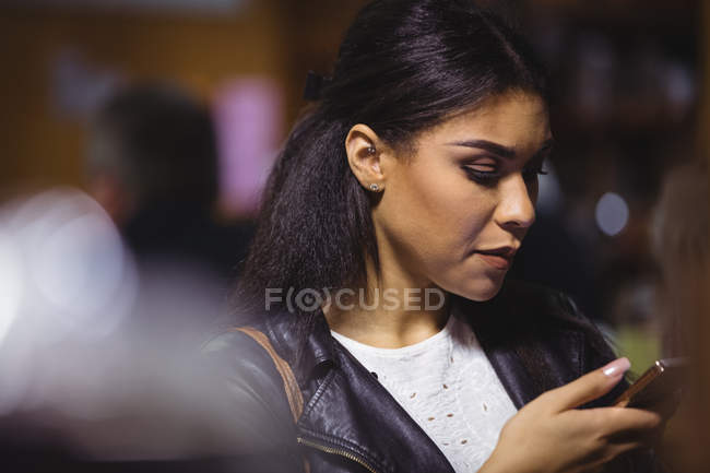 Beautiful woman using mobile phone — Stock Photo