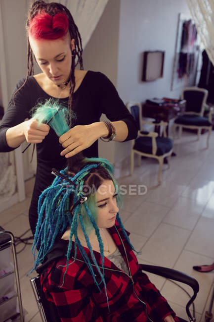 Beautician styling clients hair in dreadlocks shop — occupation, female -  Stock Photo | #225303790