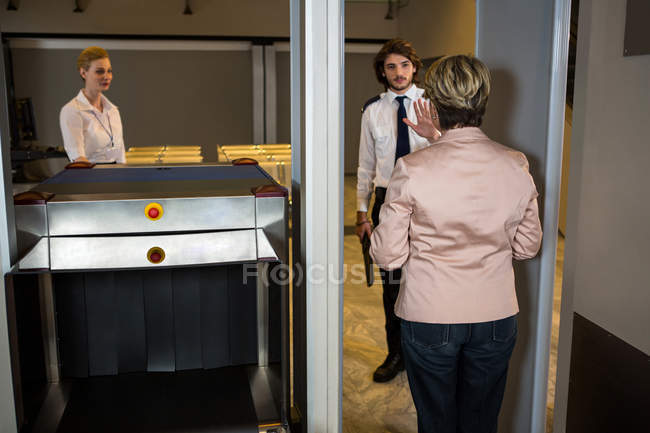 Security guard asking in the passenger to stop for the security check-in the airport terminal — Stock Photo