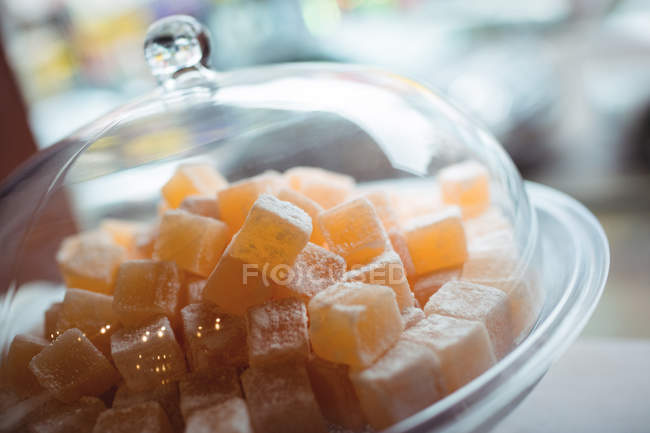 Close-up of turkish sweets in glass jar arranged on shelf in shop — Stock Photo
