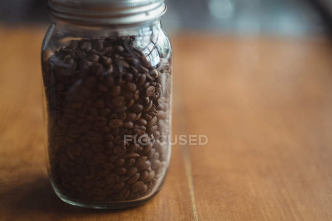 Close-up of a jar of roasted coffee beans — Stock Photo