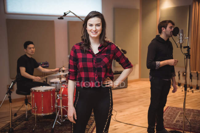 Portrait of beautiful woman smiling in recording studio — Stock Photo