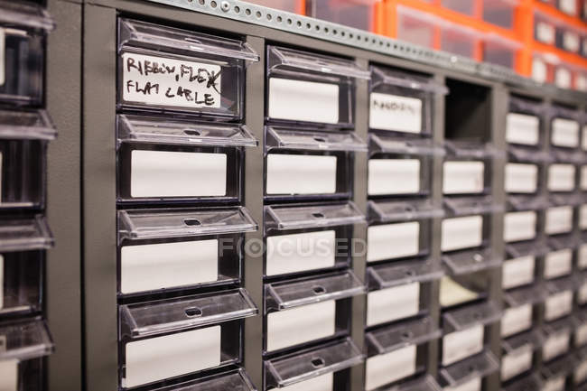 Shelves and drawers in repair centre storage room — Stock Photo