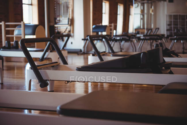 Reformer equipment in empty fitness studio interior — Stock Photo