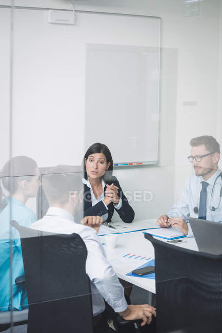 Team of doctors in a meeting at conference room — Stock Photo
