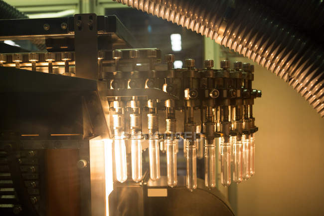 Close up of test tube machine in factory — Stock Photo