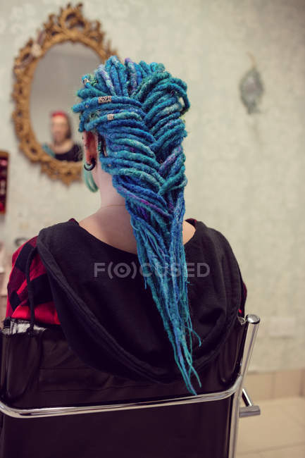 Rear view of woman with dreadlocks in salon — Stock Photo