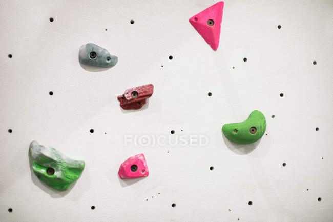 Artificial climbing wall in gym for practice — Stock Photo