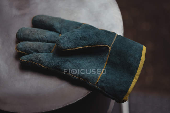 Close-up of a mitten on table — Stock Photo