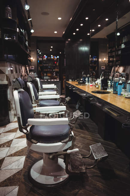 Barber chairs arranged in a row at barber shop — Stock Photo