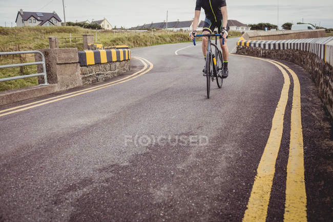 Mid-section of athlete riding sport bicycle — Stock Photo