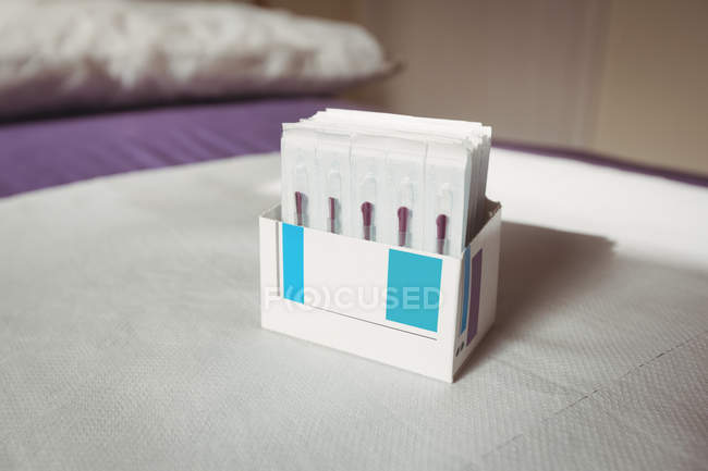 Close-up of dry needles in opened box — Stock Photo