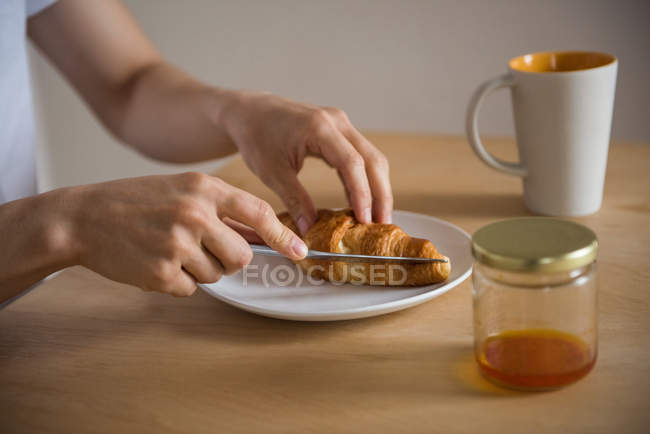 Mid-section of man having a breakfast at home — Stock Photo
