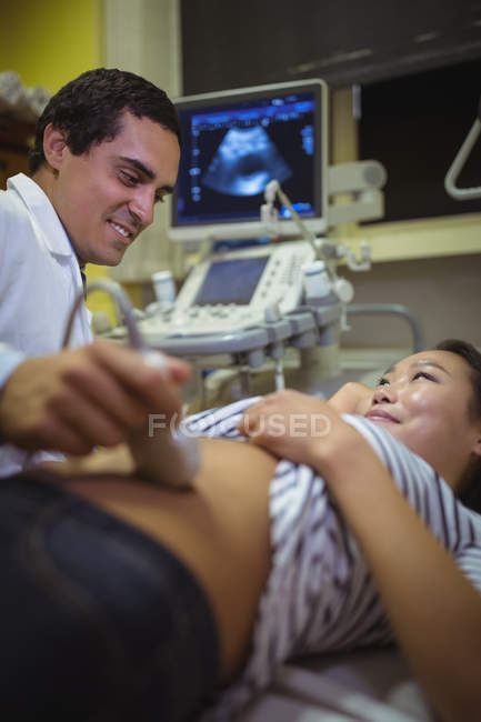 Female patient receiving a ultrasound scan on the stomach in hospital — Stock Photo