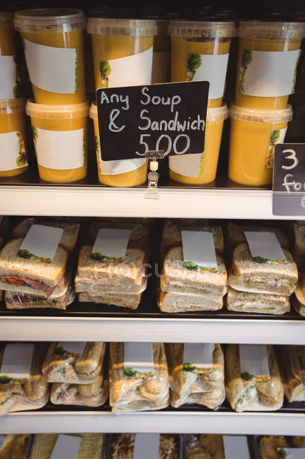 Close-up of sandwiches and soup on display in supermarket — Stock Photo