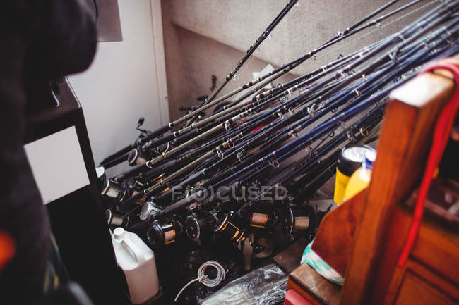 Close-up of fishing rods in fishing boat — Stock Photo