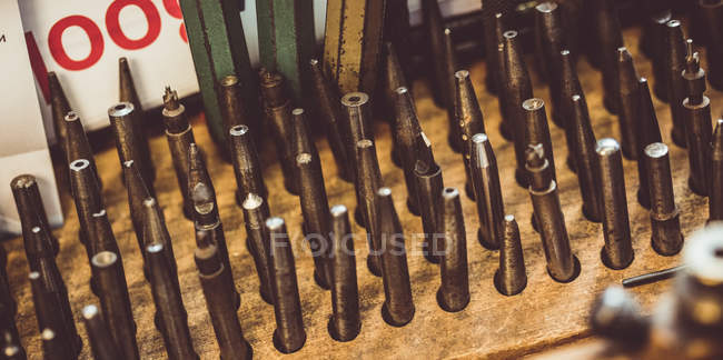 Close-up of drill bit set in a holder at workshop — Stock Photo