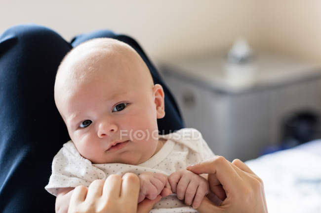 Cropped image of Mother playing with her baby in bedroom at home — Stock Photo