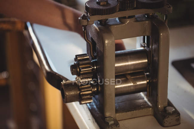 Close-up of goldsmith rolling mill in workshop — Stock Photo