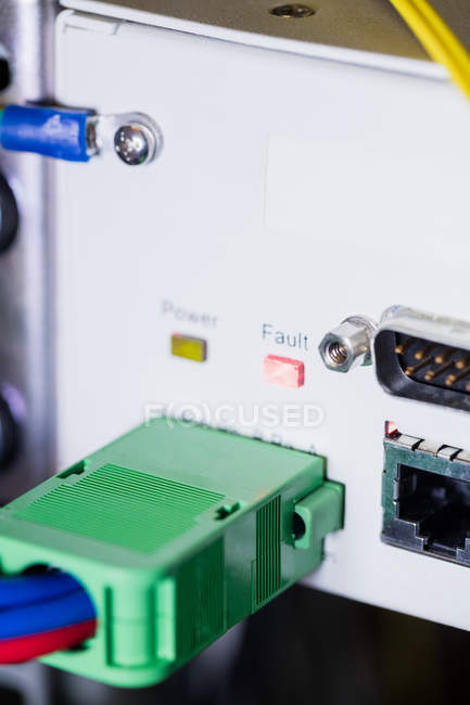 Close-up of cable connected in socket at server room — Stock Photo