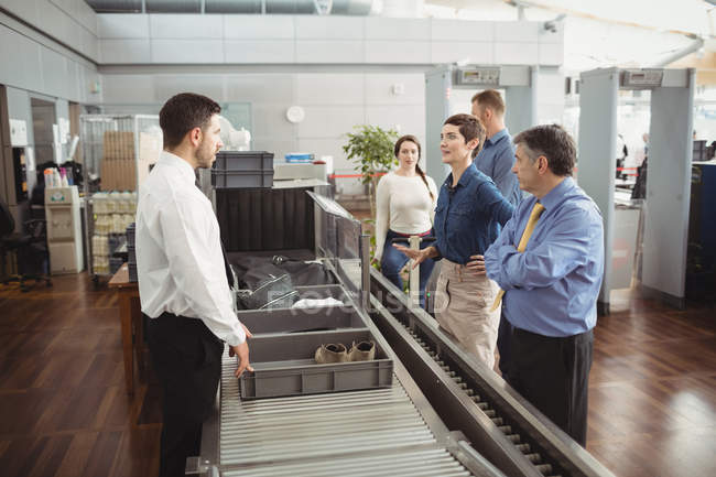 Passengers in airport security check at airport — Stock Photo