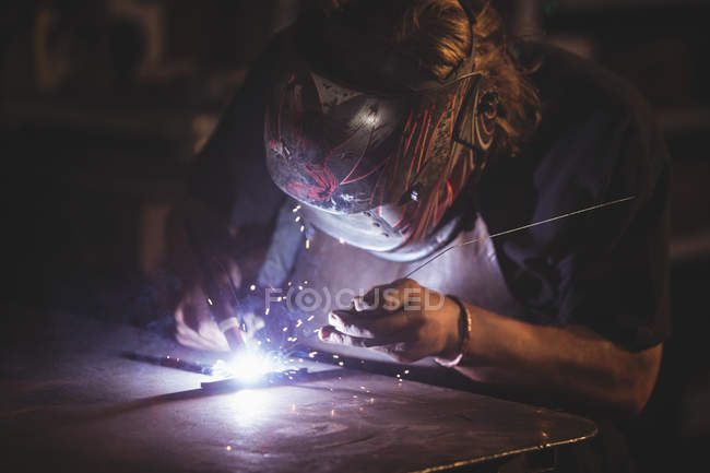 Close-up of blacksmith working at work shop — Stock Photo