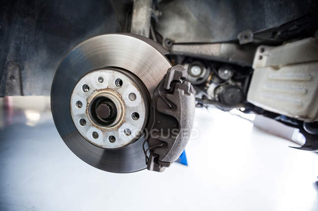 Close-up of car brake at repair garage — Stock Photo