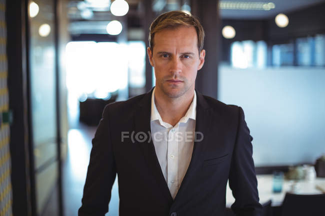 Portrait of confident businessman in office — Stock Photo