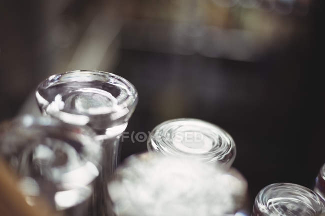 Close-up of beer glasses at bar counter — Stock Photo