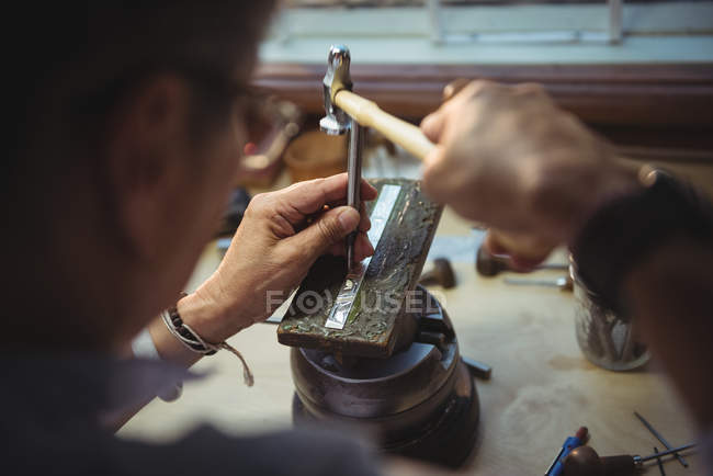 Close-up of craftswoman working in workshop — Stock Photo