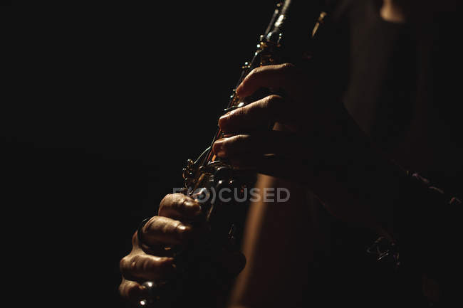 Close-up of woman playing a guitar in music school — Stock Photo