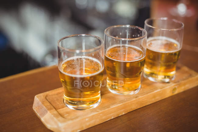 Close-up of beer glasses on the bar counter in bar — Stock Photo