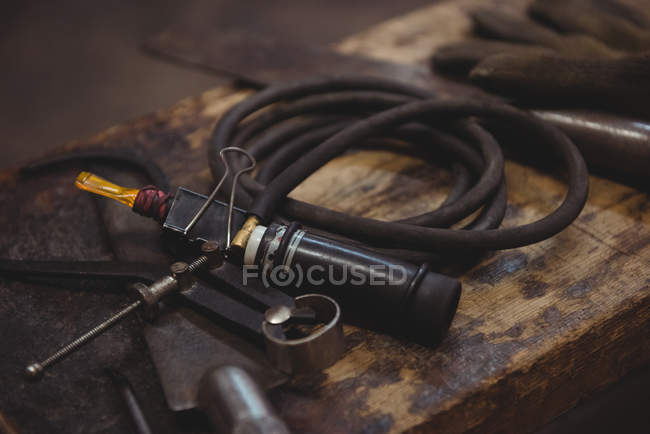 Close-up of glassblowing tools on table at glassblowing factory — Stock Photo