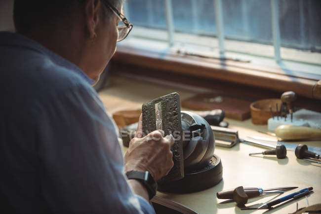 Close-up of craftswoman working in workshop — Stock Photo