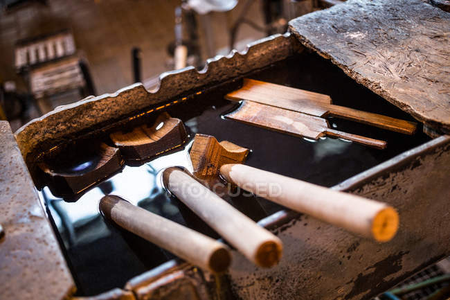 Close-up of glassblowing block in glassblowing factory with instruments — Stock Photo