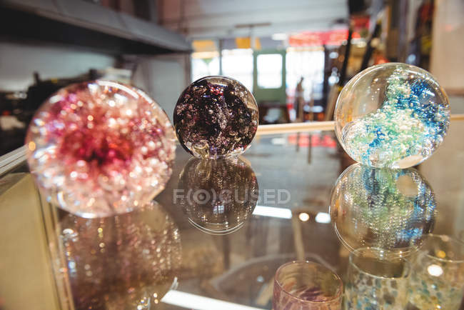 Handmade blown glassware on display at glassblowing factory — Stock Photo