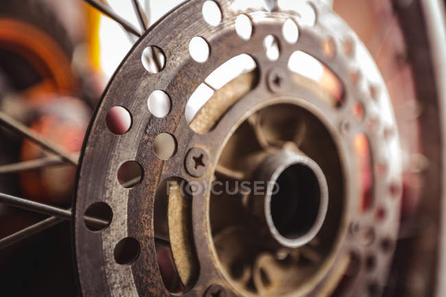 Close-up of motorcycle disc brake in workshop — Stock Photo