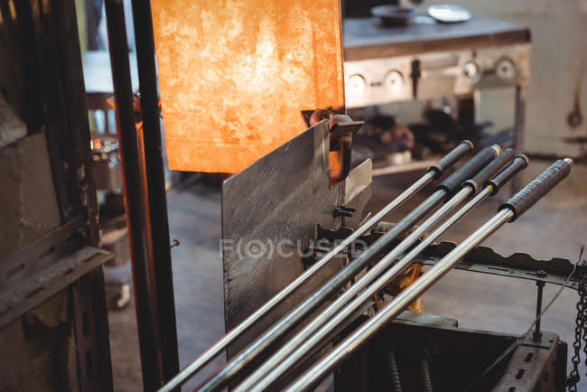 Close-up of piece of glass heated in furnace at glassblowing factory — Stock Photo