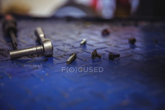 Close-up of various nuts and parts in workshop — Stock Photo