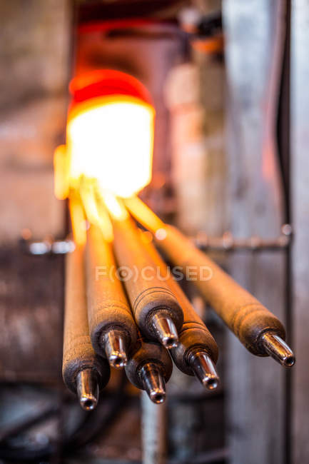 Close-up of a piece of glasses heated in furnace at glassblowing factory — Stock Photo