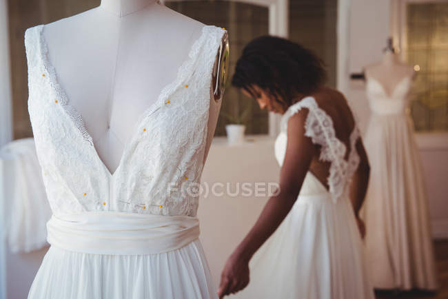 Close-up of wedding dress on mannequin in a studio — Stock Photo