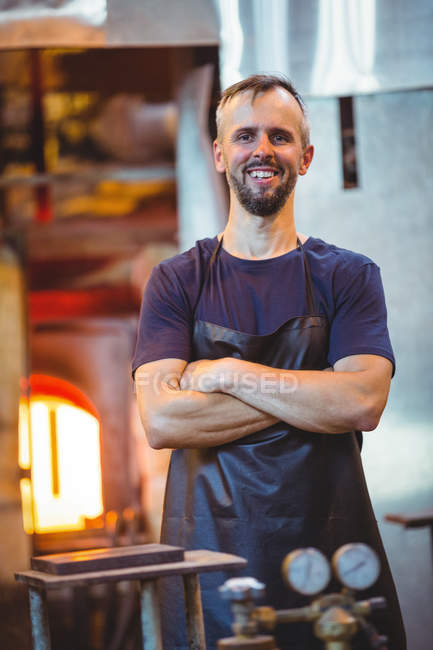 Portrait of glassblower with arms crossed at glassblowing factory — Stock Photo